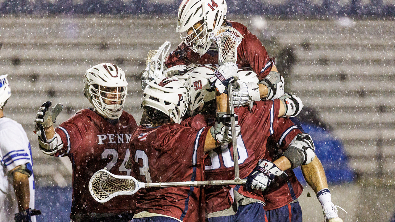 Penn lacrosse players celebrate after scoring a goal in a 14-12 win at Duke