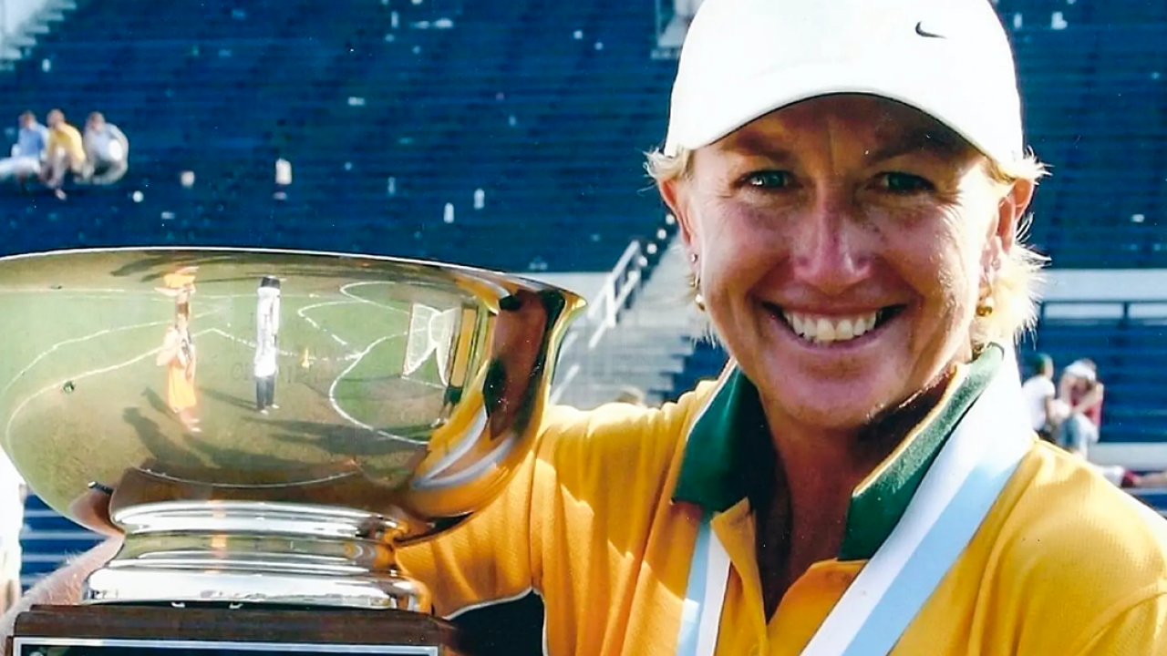 The late Sue "Melli" Sofarnos with the World Cup trophy following Australia's 14-7 win over the U.S. in the 2005 final in Annapolis, Md. 