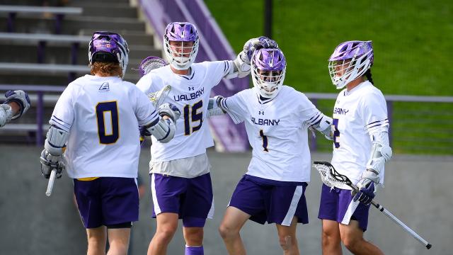 UAlbany players celebrate after a goal