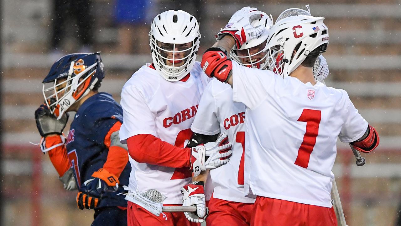 Teammates celebrate with CJ Kirst after a Cornell goal